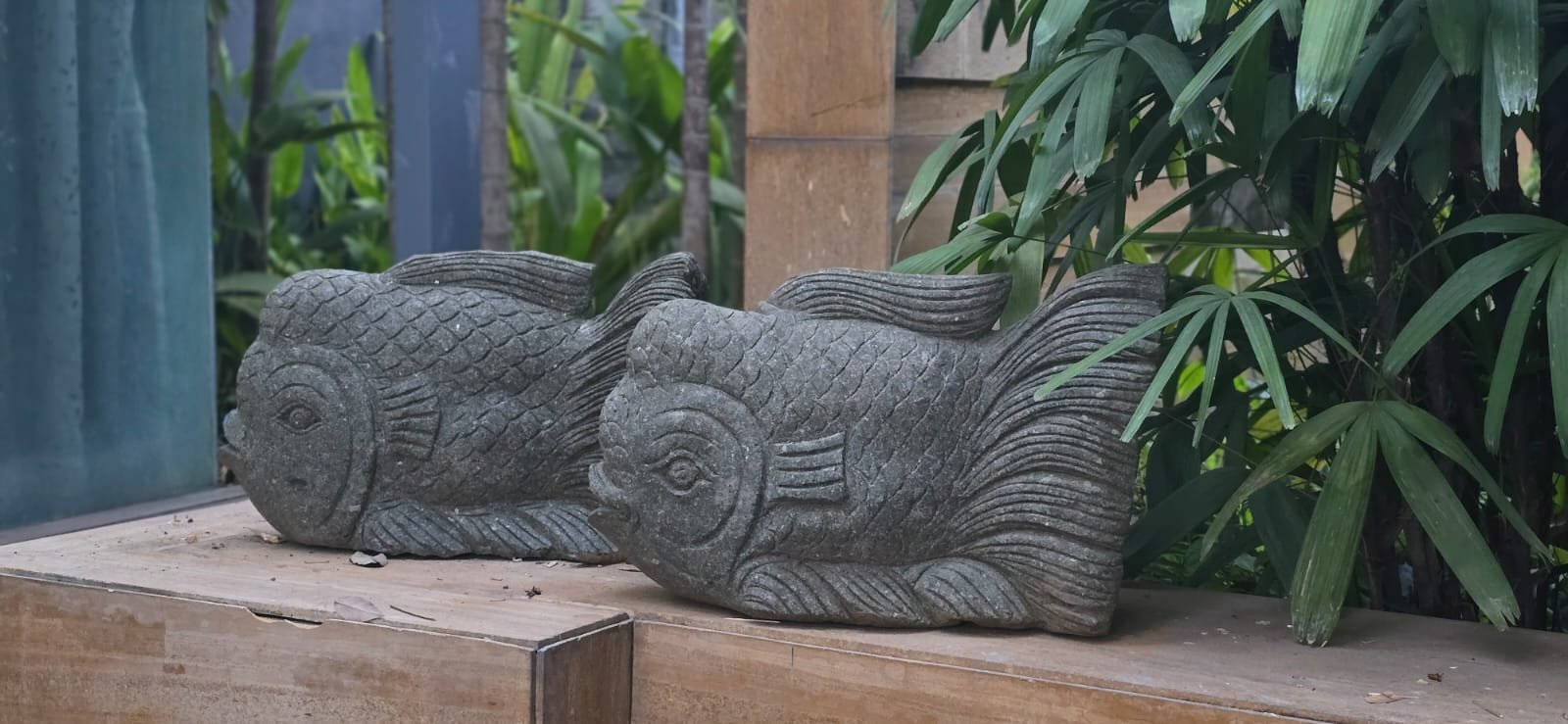 Pair of carved stone fish sculptures
