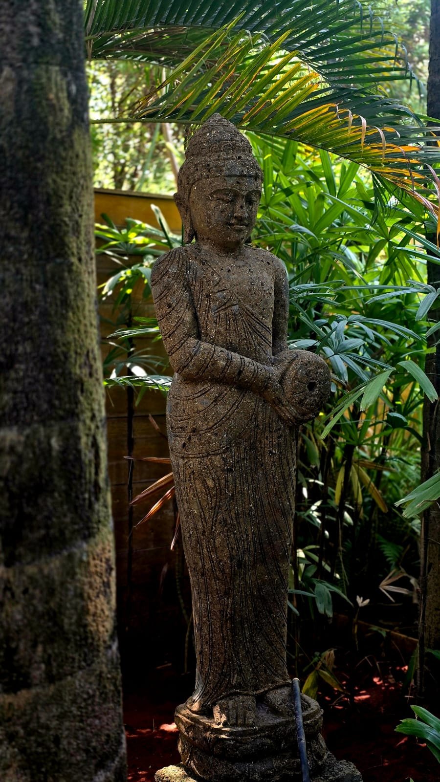 Carved stone standing statue